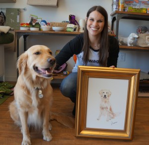 Barbara Justice of Retail Retreat with the shop mascot Juni. The portrait was painted by Isle of Hope artist Rebecca Cope from a favorite photo.  Juni is German for the month of June.
